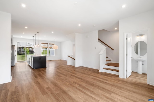 4454 Alston St, Crozet, VA 22932 - unfurnished living room with recessed lighting, wood finished floors, and stairway