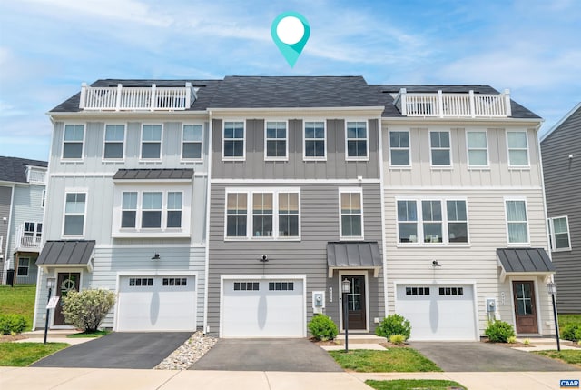 4454 Alston St, Crozet, VA 22932 - townhome / multi-family property featuring driveway, board and batten siding, an attached garage, and a balcony
