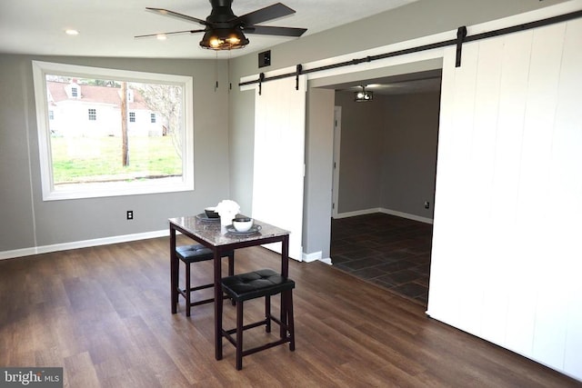 7435 Courthouse Rd, Spotsylvania, VA 22551 - dining space featuring a barn door, dark wood finished floors, a ceiling fan, and recessed lighting
