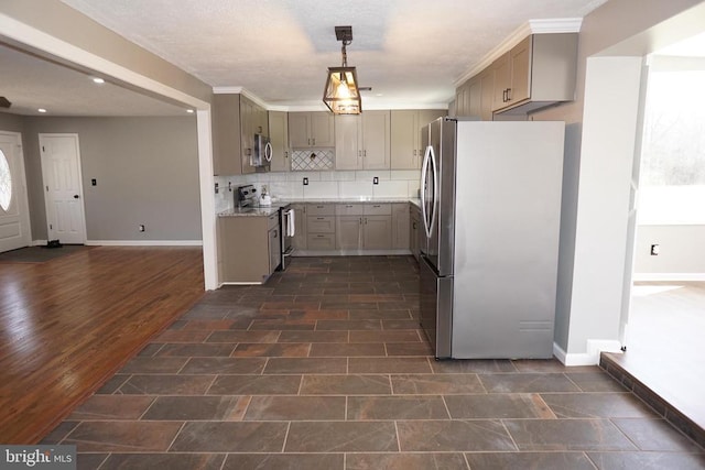 7435 Courthouse Rd, Spotsylvania, VA 22551 - kitchen with stainless steel appliances, baseboards, tasteful backsplash, light countertops, and hanging light fixtures