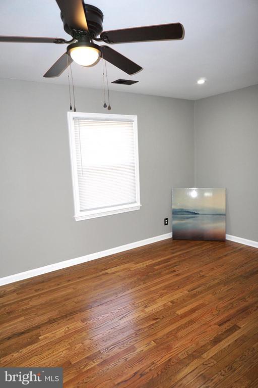 7435 Courthouse Rd, Spotsylvania, VA 22551 - unfurnished room featuring ceiling fan, wood finished floors, and baseboards