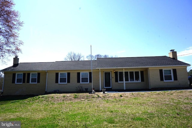 7435 Courthouse Rd, Spotsylvania, VA 22551 - single story home featuring a chimney, a front lawn, brick siding, and a patio