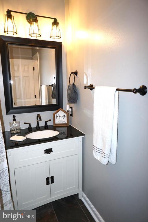 7435 Courthouse Rd, Spotsylvania, VA 22551 - bathroom with vanity, tile patterned flooring, and baseboards