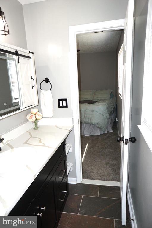 7435 Courthouse Rd, Spotsylvania, VA 22551 - bathroom featuring vanity and connected bathroom