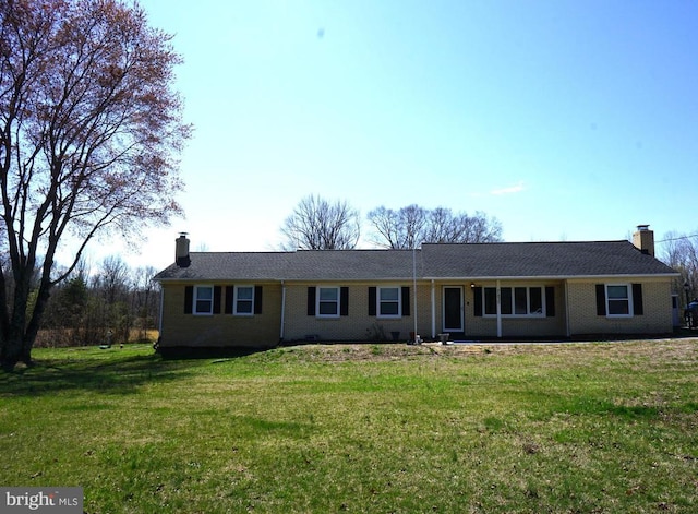 7435 Courthouse Rd, Spotsylvania, VA 22551 - ranch-style home with a chimney, a front lawn, and brick siding