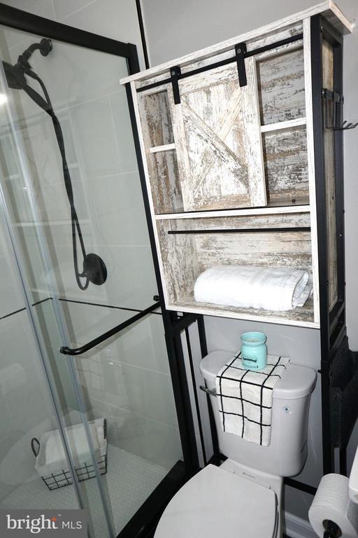 7435 Courthouse Rd, Spotsylvania, VA 22551 - bathroom featuring toilet and a shower stall