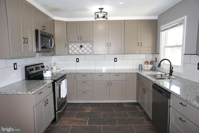 7435 Courthouse Rd, Spotsylvania, VA 22551 - kitchen featuring stainless steel appliances, a sink, stone finish floors, decorative backsplash, and light stone counters
