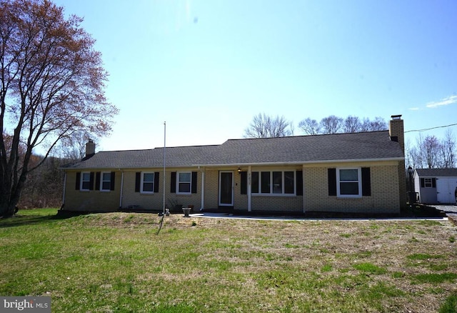 7435 Courthouse Rd, Spotsylvania, VA 22551 - ranch-style house with a chimney, a front yard, and brick siding