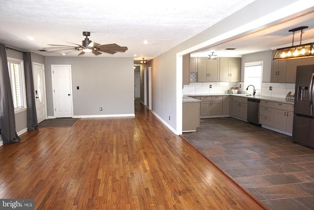 7435 Courthouse Rd, Spotsylvania, VA 22551 - kitchen with stainless steel appliances, a ceiling fan, gray cabinets, open floor plan, and baseboards