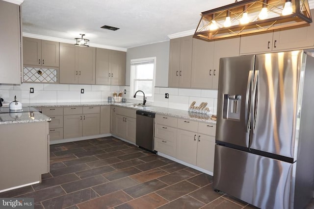 7435 Courthouse Rd, Spotsylvania, VA 22551 - kitchen featuring stainless steel appliances, backsplash, a sink, light stone counters, and ornamental molding