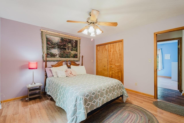 bedroom featuring light wood finished floors, baseboards, a closet, and ceiling fan