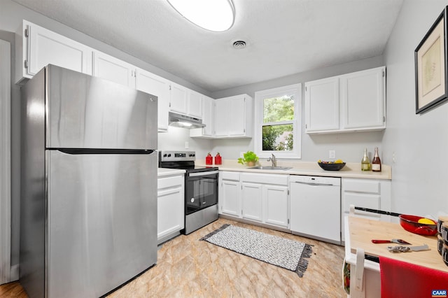 147 Scarborough Pl, Charlottesville, VA 22903 - kitchen featuring stainless steel appliances, under cabinet range hood, a sink, and white cabinetry