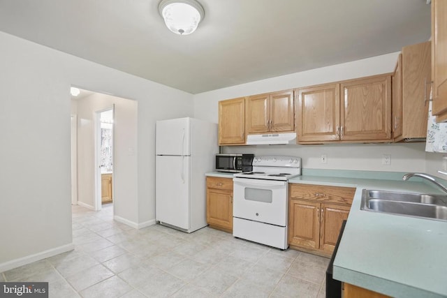 9071 Old Culpeper Rd, Warrenton, VA 20186 - kitchen with white appliances, under cabinet range hood, light countertops, and light tile patterned floors