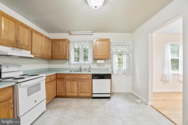 9071 Old Culpeper Rd, Warrenton, VA 20186 - kitchen with white appliances, under cabinet range hood, light countertops, and light tile patterned floors