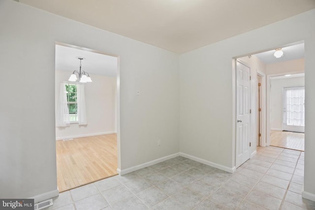 9071 Old Culpeper Rd, Warrenton, VA 20186 - unfurnished room featuring a chandelier and light tile patterned floors