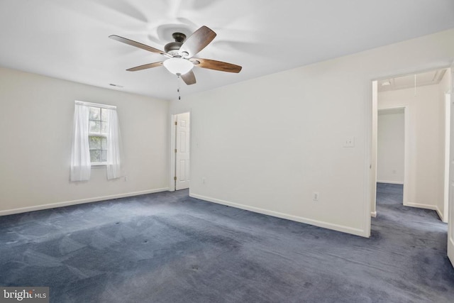 9071 Old Culpeper Rd, Warrenton, VA 20186 - spare room featuring attic access, a ceiling fan, and dark colored carpet