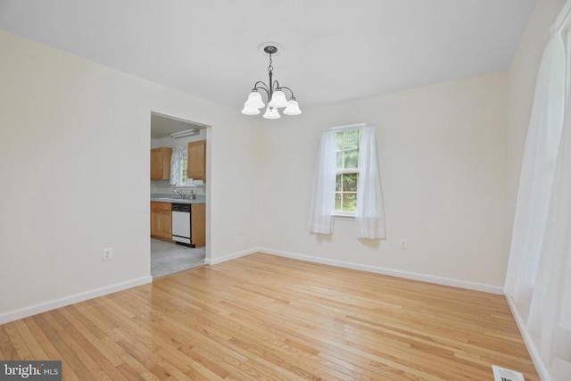 9071 Old Culpeper Rd, Warrenton, VA 20186 - empty room with a chandelier and light wood finished floors