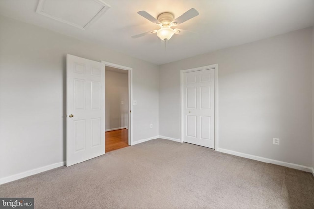  - unfurnished bedroom featuring carpet, baseboards, and ceiling fan