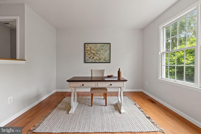  - home office with wood finished floors and baseboards