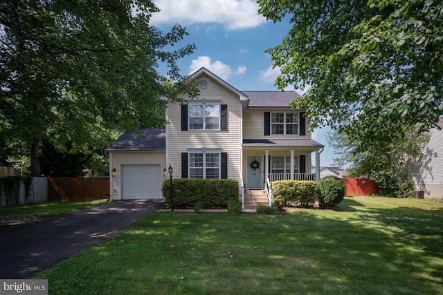 5008 Blake Dr, Fredericksburg, VA 22407 - traditional-style home featuring asphalt driveway, an attached garage, and covered porch