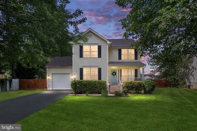 5008 Blake Dr, Fredericksburg, VA 22407 - traditional home with driveway, an attached garage, a porch, and roof with shingles