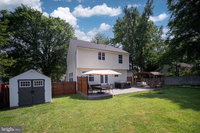 5008 Blake Dr, Fredericksburg, VA 22407 - back of property with a storage shed, a patio area, a fenced backyard, and french doors