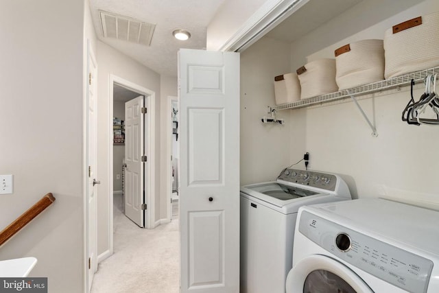 5008 Blake Dr, Fredericksburg, VA 22407 - washroom featuring washing machine and clothes dryer and light carpet