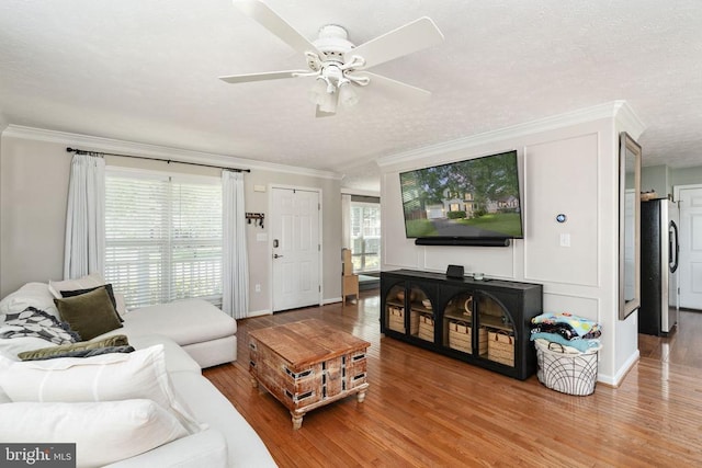 5008 Blake Dr, Fredericksburg, VA 22407 - living room featuring ornamental molding, wood finished floors, ceiling fan, and a textured ceiling
