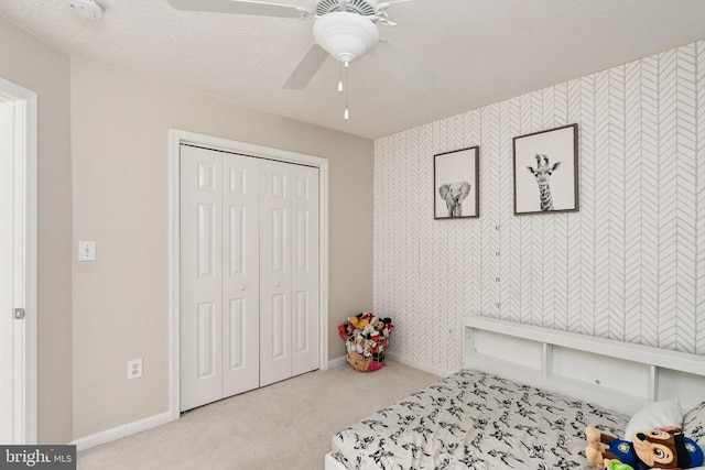5008 Blake Dr, Fredericksburg, VA 22407 - bedroom with carpet flooring, wallpapered walls, a closet, and ceiling fan