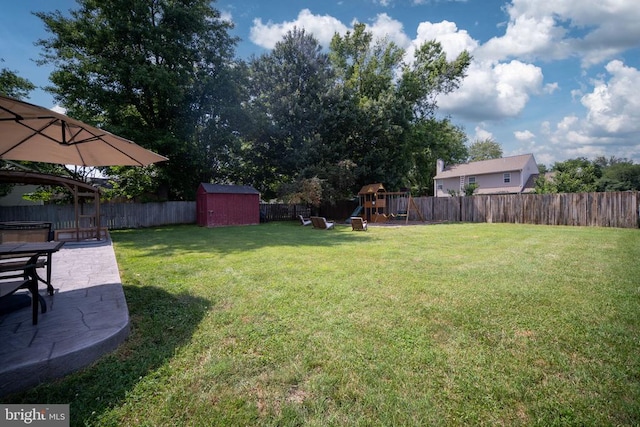 5008 Blake Dr, Fredericksburg, VA 22407 - fenced backyard with a playground, a patio, and a storage shed