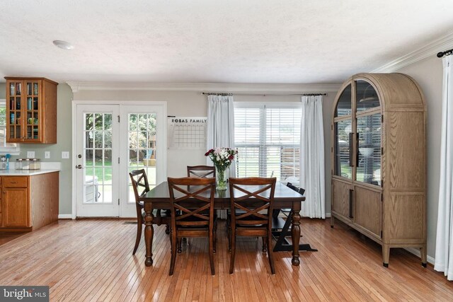 5008 Blake Dr, Fredericksburg, VA 22407 - dining room featuring light wood finished floors, healthy amount of natural light, and crown molding