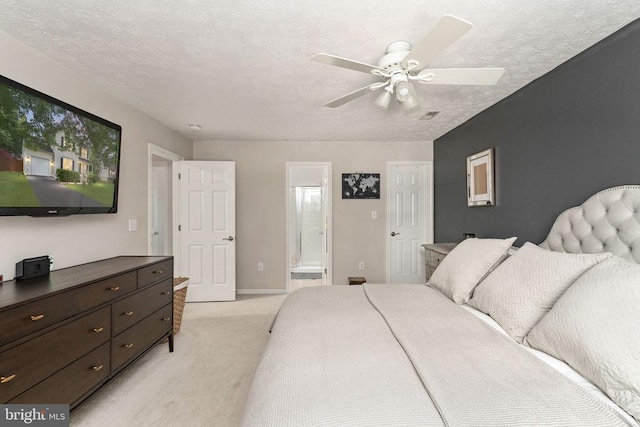 5008 Blake Dr, Fredericksburg, VA 22407 - bedroom featuring light carpet, ensuite bath, a textured ceiling, and a ceiling fan