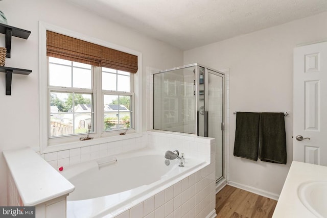 5008 Blake Dr, Fredericksburg, VA 22407 - full bath with a bath, a shower stall, wood finished floors, and vanity
