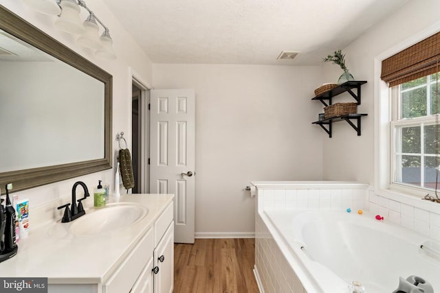 5008 Blake Dr, Fredericksburg, VA 22407 - full bath featuring vanity, a bath, and wood finished floors