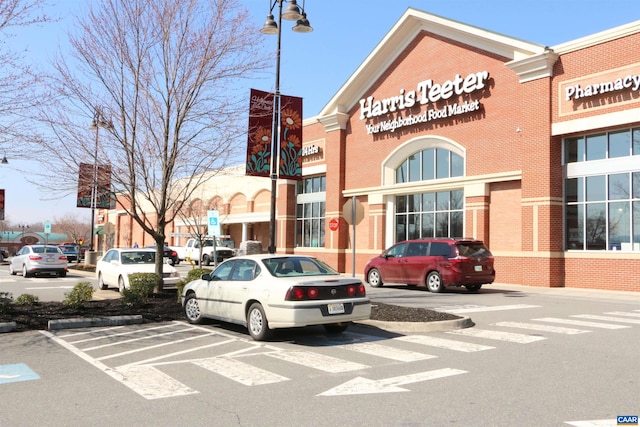 view of property featuring uncovered parking