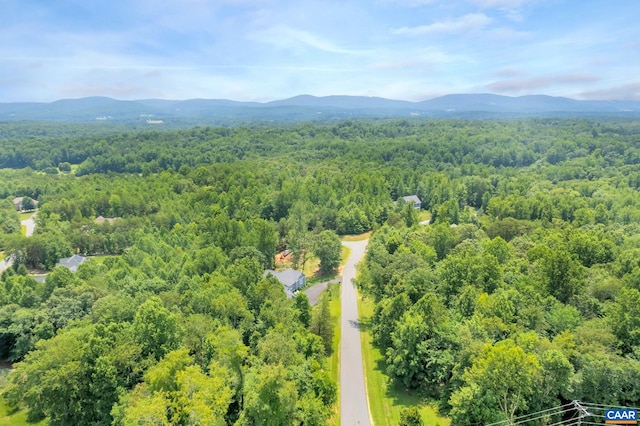 bird's eye view featuring a mountain view and a view of trees