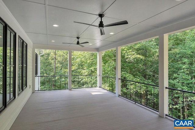 wooden deck featuring a ceiling fan