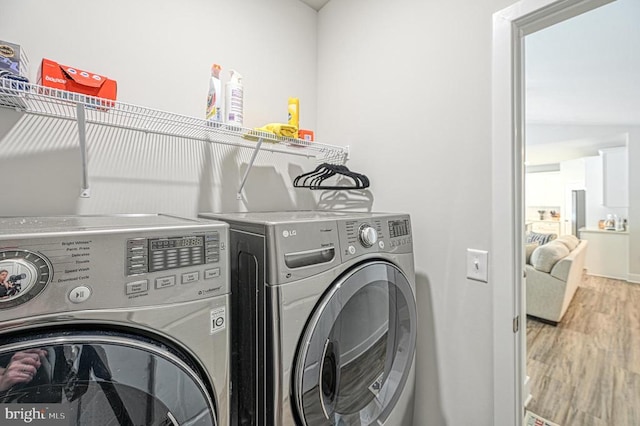 5220 Wyndemere Cir, Mineral, VA 23117 - laundry area featuring washing machine and clothes dryer and wood finished floors