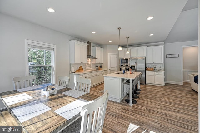 5220 Wyndemere Cir, Mineral, VA 23117 - dining area featuring recessed lighting, dark wood-type flooring, and vaulted ceiling
