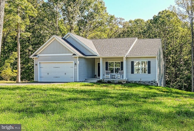 5220 Wyndemere Cir, Mineral, VA 23117 - view of front of house with covered porch, board and batten siding, an attached garage, a front yard, and a shingled roof