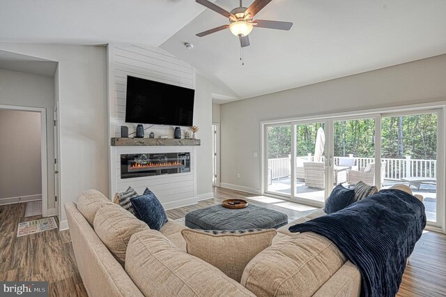 5220 Wyndemere Cir, Mineral, VA 23117 - living area with a large fireplace, a ceiling fan, lofted ceiling, wood finished floors, and baseboards