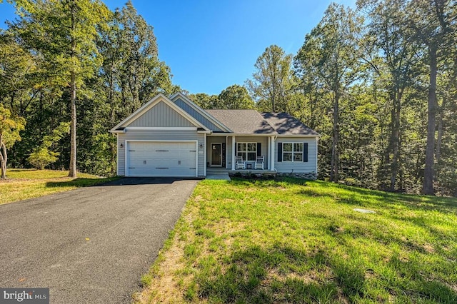 5220 Wyndemere Cir, Mineral, VA 23117 - view of front of home with driveway, covered porch, a garage, and a front lawn
