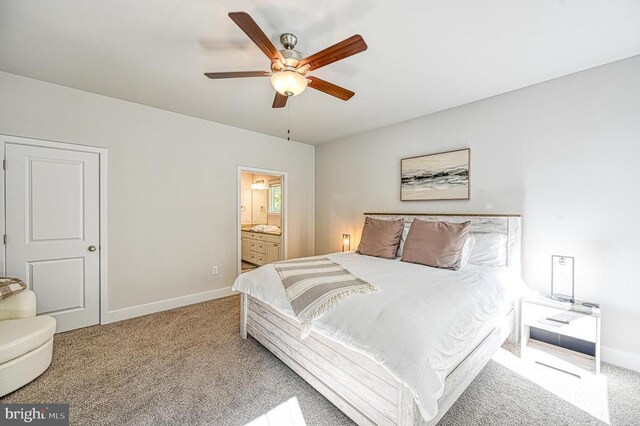 5220 Wyndemere Cir, Mineral, VA 23117 - carpeted bedroom featuring baseboards, ensuite bath, and a ceiling fan