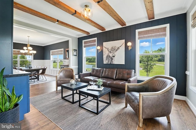 10901 Brandermill Park, Spotsylvania, VA 22551 - living room with beamed ceiling, a chandelier, wood finished floors, a decorative wall, and crown molding