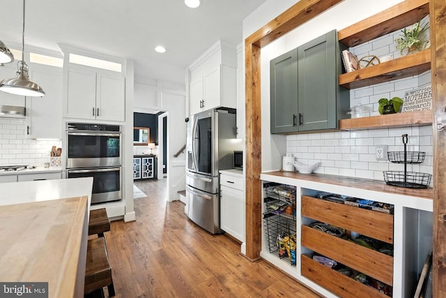 10901 Brandermill Park, Spotsylvania, VA 22551 - kitchen with stainless steel appliances, backsplash, wood finished floors, recessed lighting, and open shelves