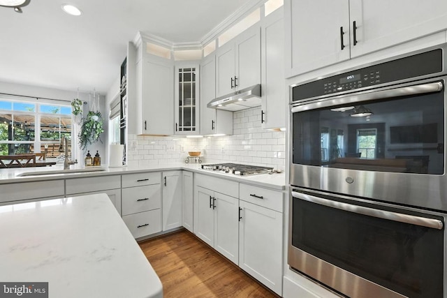 10901 Brandermill Park, Spotsylvania, VA 22551 - kitchen with stainless steel appliances, light countertops, tasteful backsplash, white cabinets, and recessed lighting