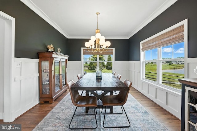 10901 Brandermill Park, Spotsylvania, VA 22551 - dining room featuring a chandelier, healthy amount of natural light, wood finished floors, a decorative wall, and crown molding