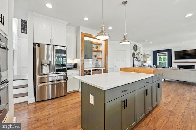 10901 Brandermill Park, Spotsylvania, VA 22551 - kitchen featuring appliances with stainless steel finishes, white cabinets, gray cabinets, light wood-type flooring, and recessed lighting