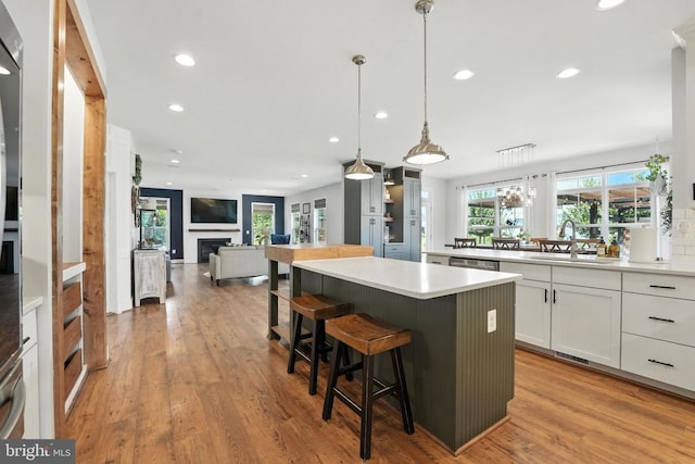 10901 Brandermill Park, Spotsylvania, VA 22551 - kitchen featuring white cabinets, a kitchen island, open floor plan, recessed lighting, and light countertops