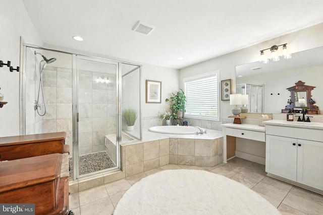 10901 Brandermill Park, Spotsylvania, VA 22551 - bathroom featuring tile patterned floors, vanity, a shower stall, a garden tub, and recessed lighting